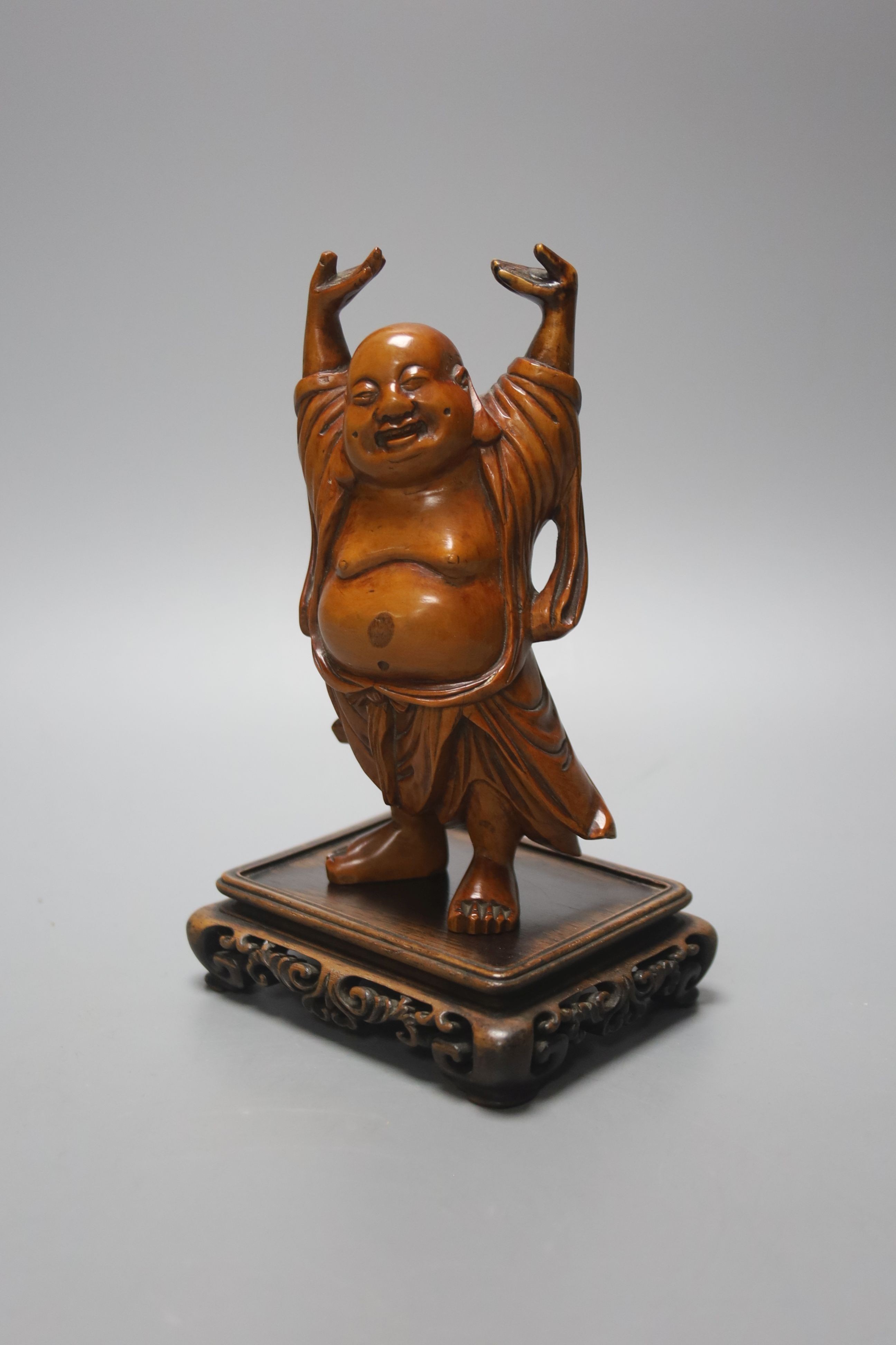 A Chinese boxwood figure of Budai standing, on a hardwood stand 14cm excl stand